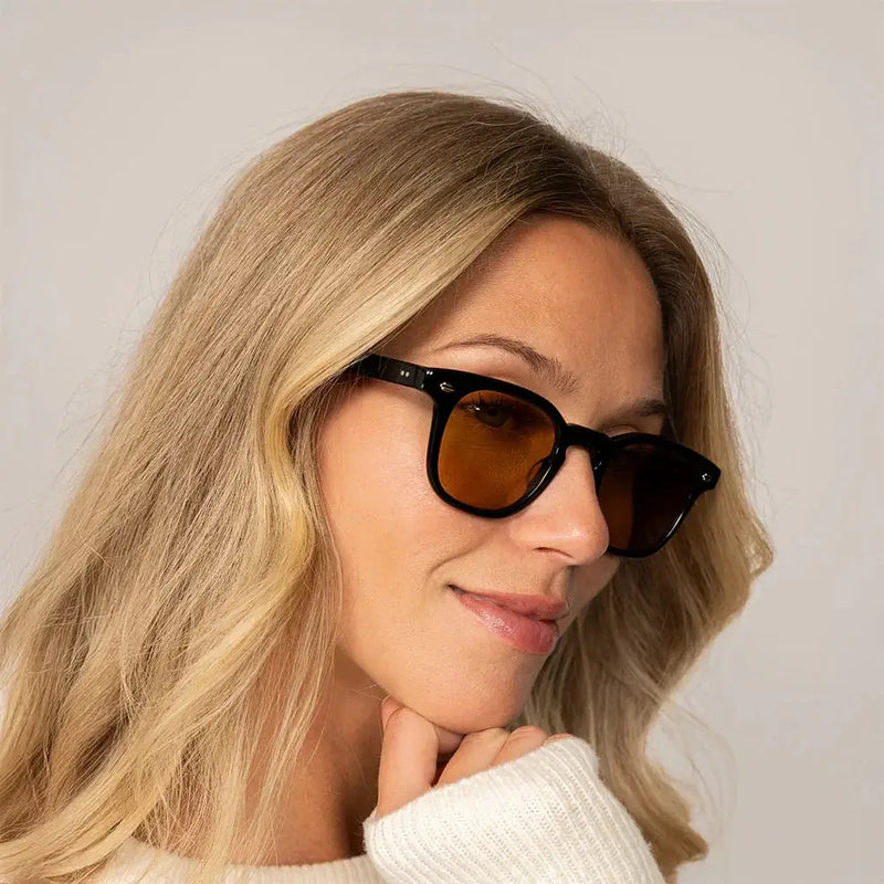 Woman wearing Garrett Leight Sherwood Sun Sunglasses in Black, front view.|black