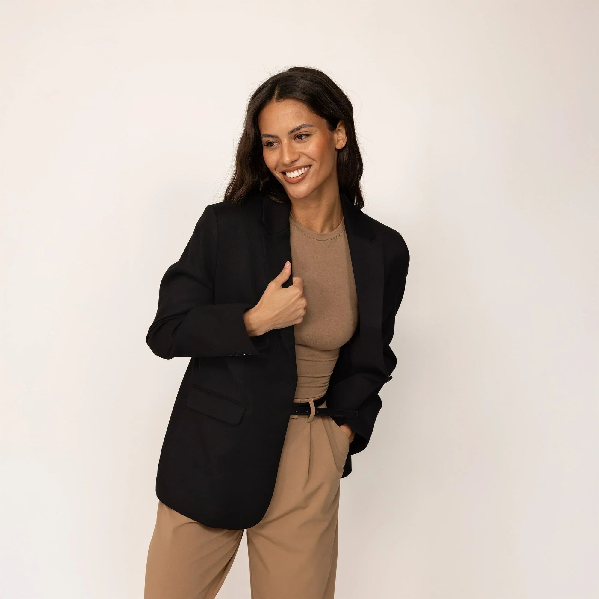 Woman wearing a Marame Classic Blazer in Black, front view. |black