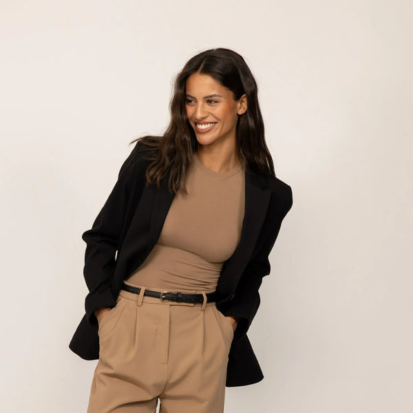 Woman wearing a Marame Classic Blazer in Black, front view.