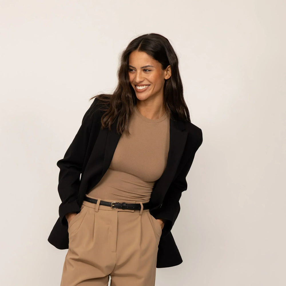 Woman wearing a Marame Classic Blazer in Black, front view.