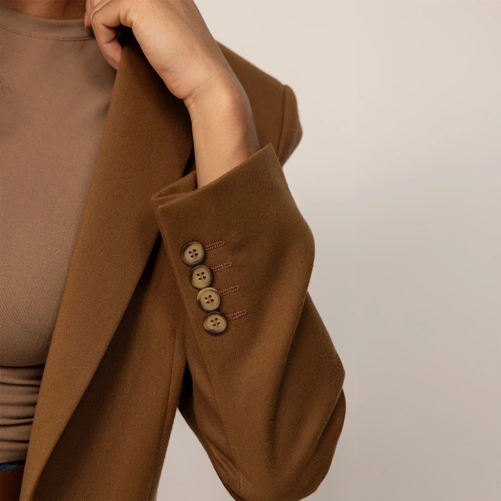 Woman wearing a Marame Classic Blazer in Brown Toffee, closeup. |brown toffee
