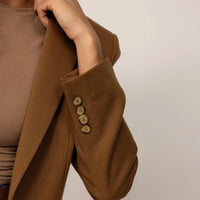 Woman wearing a Marame Classic Blazer in Brown Toffee, closeup. |brown toffee