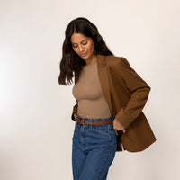 Woman wearing a Marame Classic Blazer in Brown Toffee, front view.