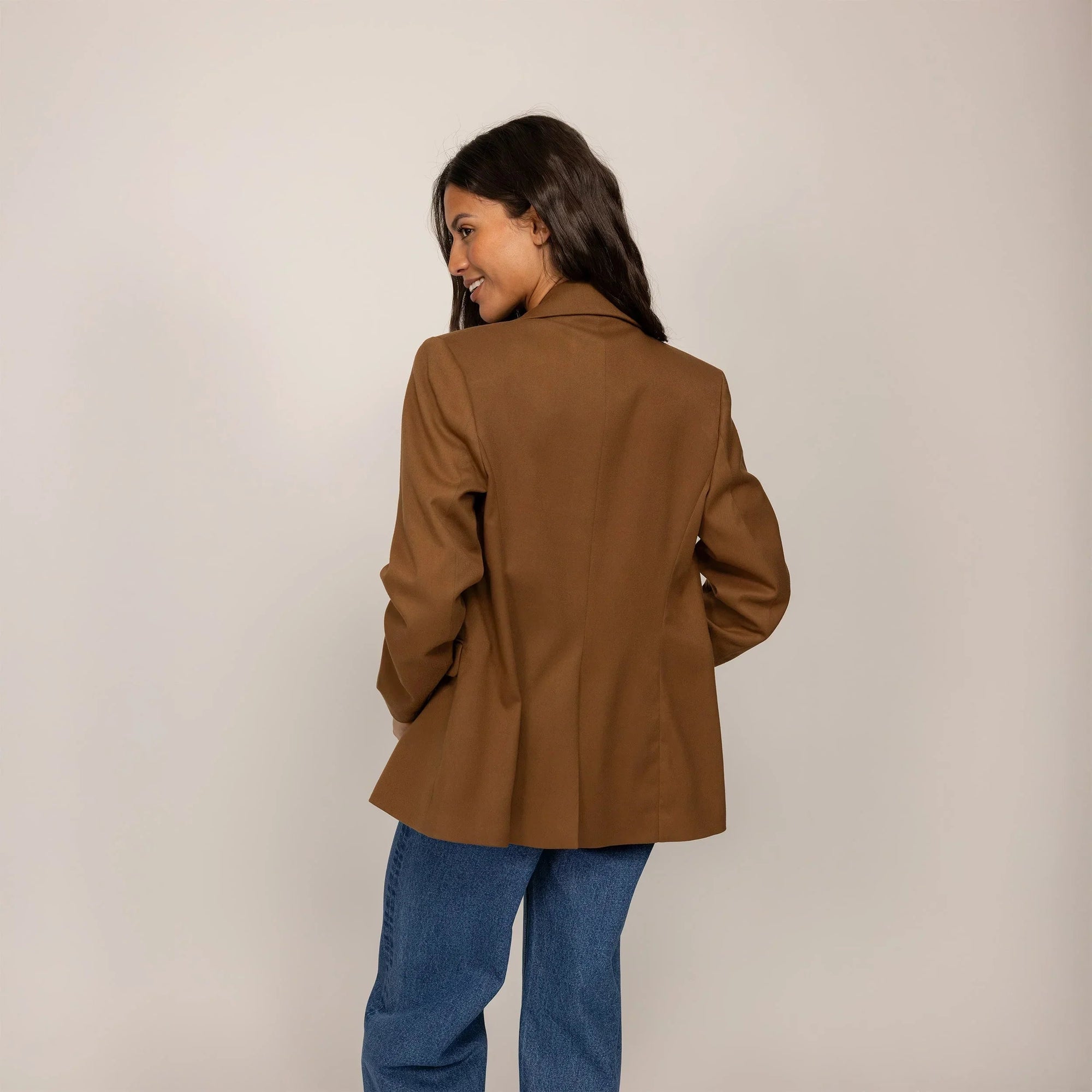 Woman wearing a Marame Classic Blazer in Brown Toffee, rear view. |brown toffee