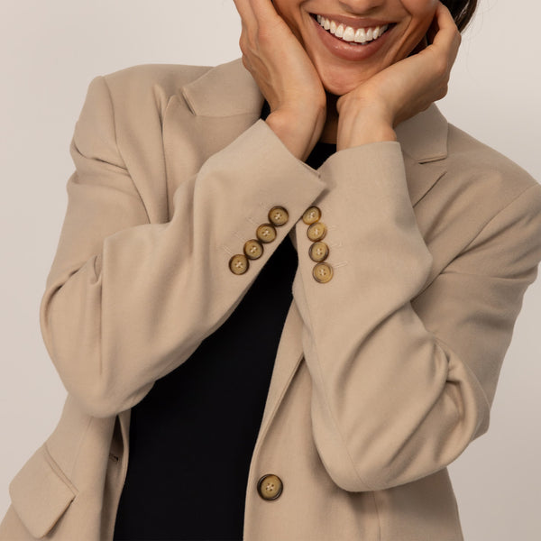 Woman wearing a Classic Blazer in Natural Beige, detail.