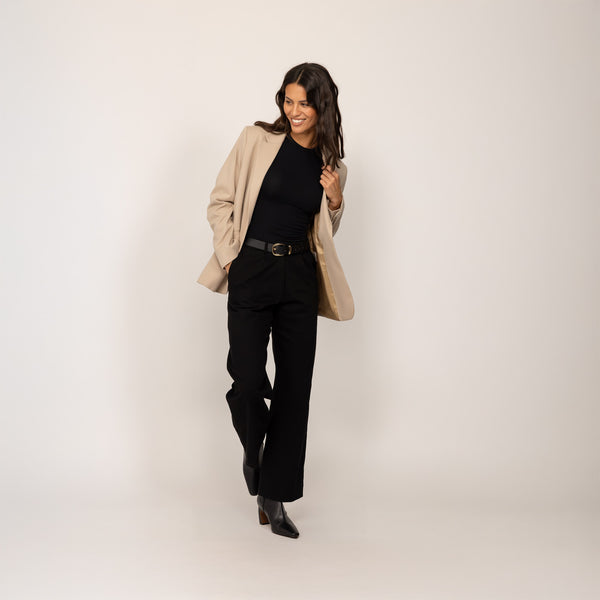 Woman wearing a Marame Classic Blazer in Natural Beige, front view.