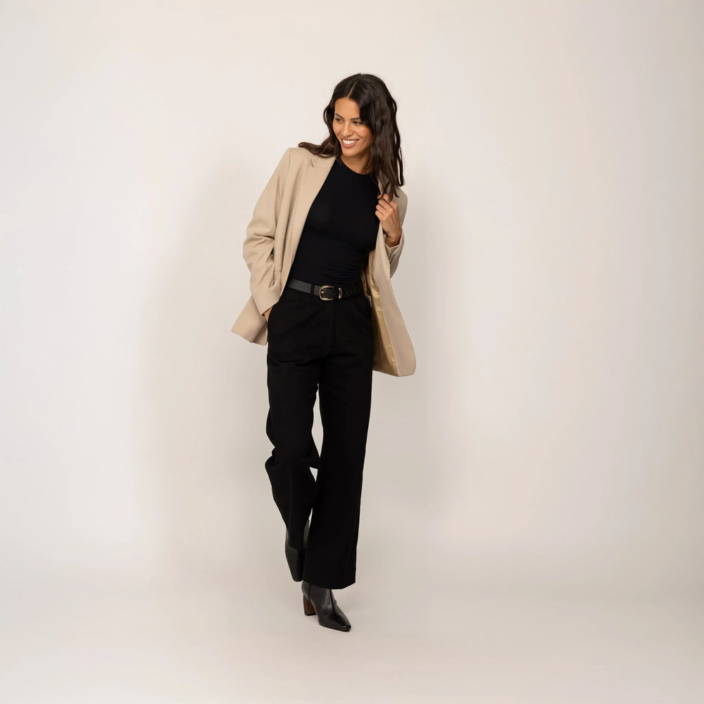 Woman wearing a Marame Classic Blazer in Natural Beige, front view.