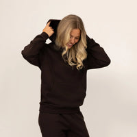 Woman wearing Marame cotton fleece hoodie in Smoked Brown.