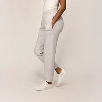 Woman wearing Marame cotton fleece Joggers in Ash White, front view.|ash white