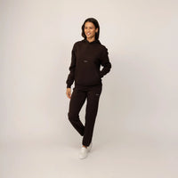 Woman wearing Marame cotton fleece Joggers in Smoked Brown, full view.|smoked brown