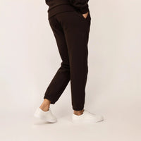 Woman wearing Marame cotton fleece Joggers in Smoked Brown, rear view.|smoked brown