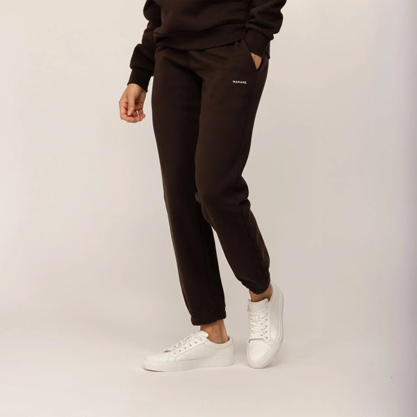 Woman wearing Marame cotton fleece Joggers in Smoked Brown, front view.|smoked brown