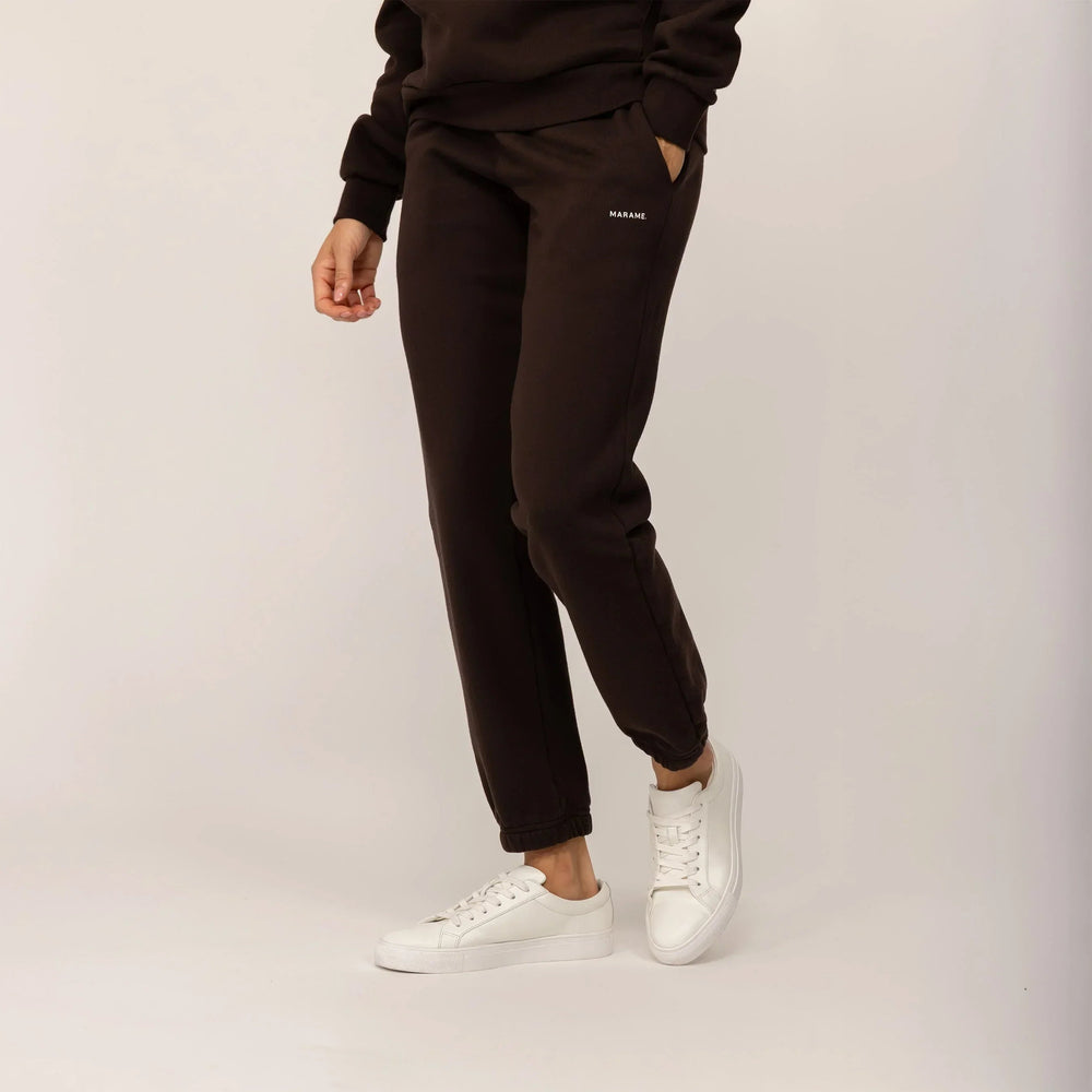 Woman wearing Marame cotton fleece Joggers in Smoked Brown, front view.|smoked brown