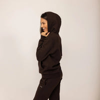 Woman wearing cotton fleece Logo Hoodie in Smoked Brown, side view.|smoked brown