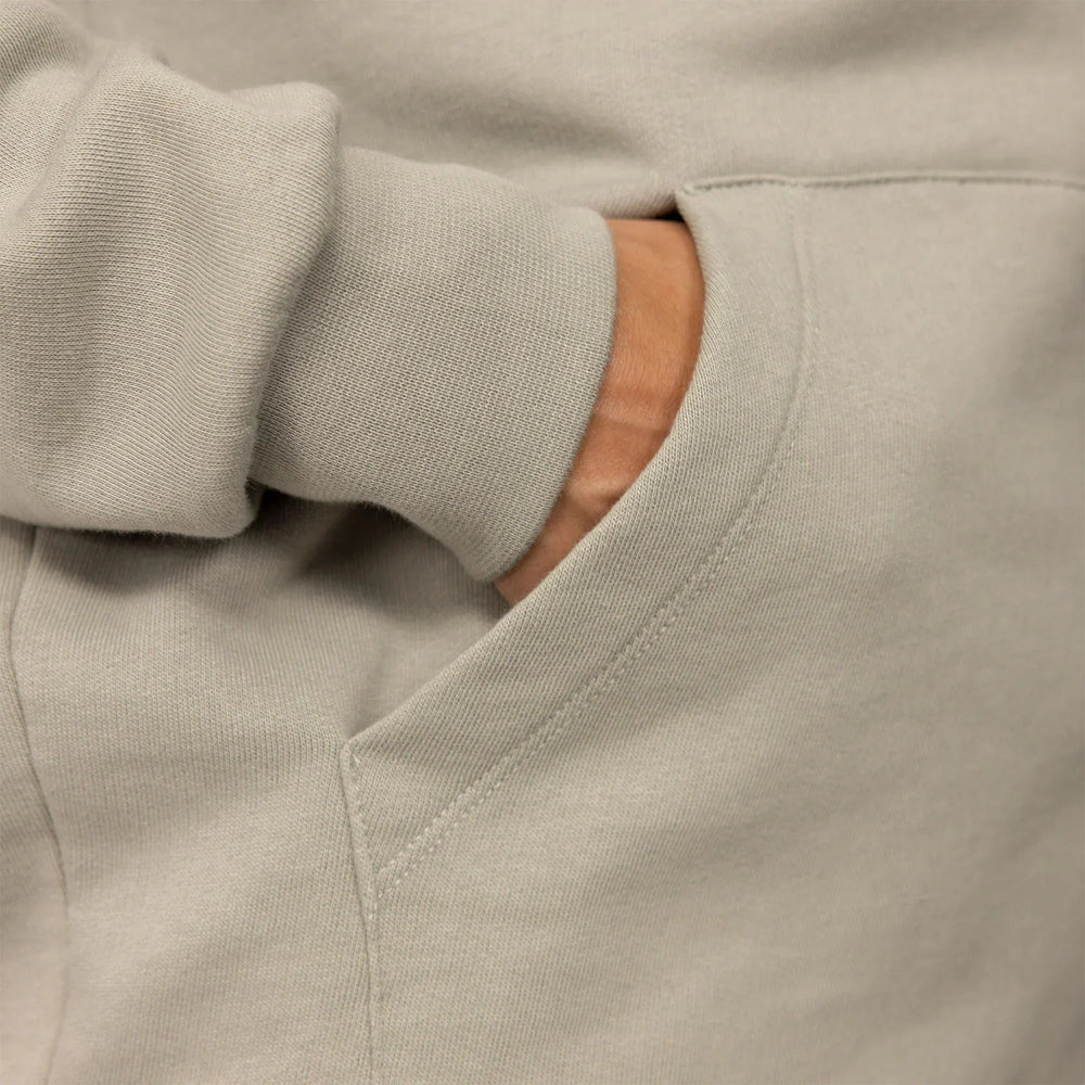Woman wearing a cotton fleece Logo Hoodie in Wolf Grey, detail.