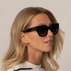 Women wearing Cutler and Gross Square Sunglasses 1422 in Black, front view.|black