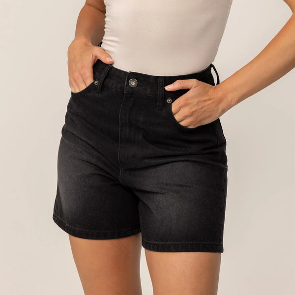 Woman wearing Marame Denim Shorts in Black Wash Denim, front view.