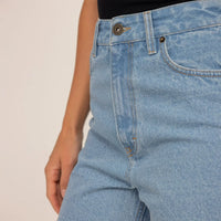 Woman wearing Denim Shorts in Light Wash Denim, closeup.