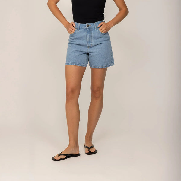 Woman wearing Marame Denim Shorts in Light Wash Denim, front view.