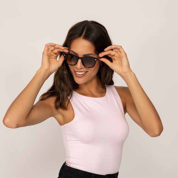 Woman wearing Double Layer Fitted Vest in Ballet Pink, closeup.