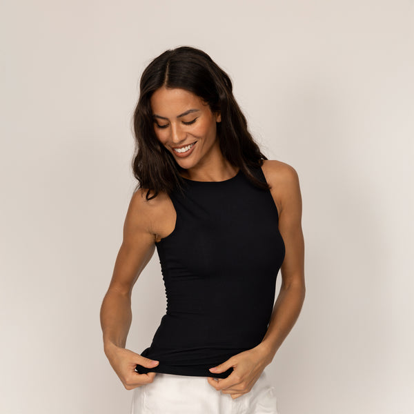 Woman wearing Marame Double Layer Fitted Vest in Black, front view.