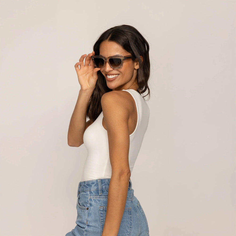 Woman wearing Marame Double Layer Fitted Vest in White, rear view.