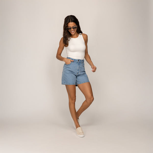 Woman wearing Marame Double Layer Fitted Vest in White, full view.