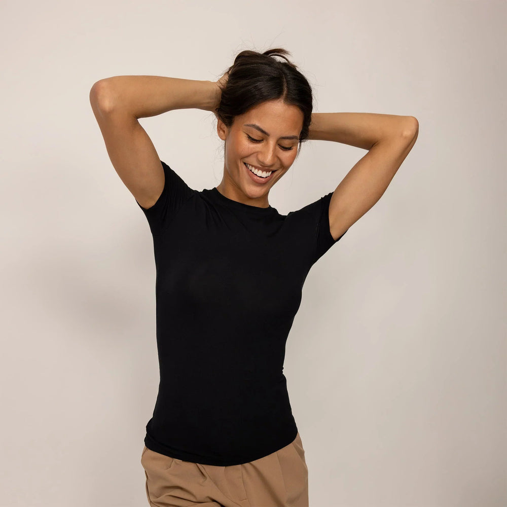 Woman wearing a Marame Fitted T-Shirt in Black, front view.|black