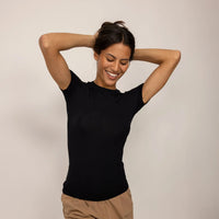 Woman wearing a Marame Fitted T-Shirt in Black, front view.|black