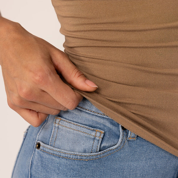 Woman wearing a Marame Fitted T-Shirt in Cinnamon Sugar, closeup.