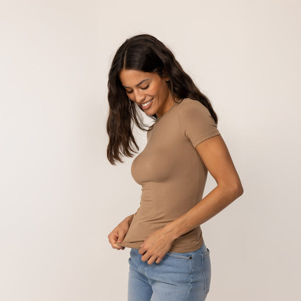 Woman wearing a Marame Fitted T-Shirt in Cinnamon Sugar, front view.