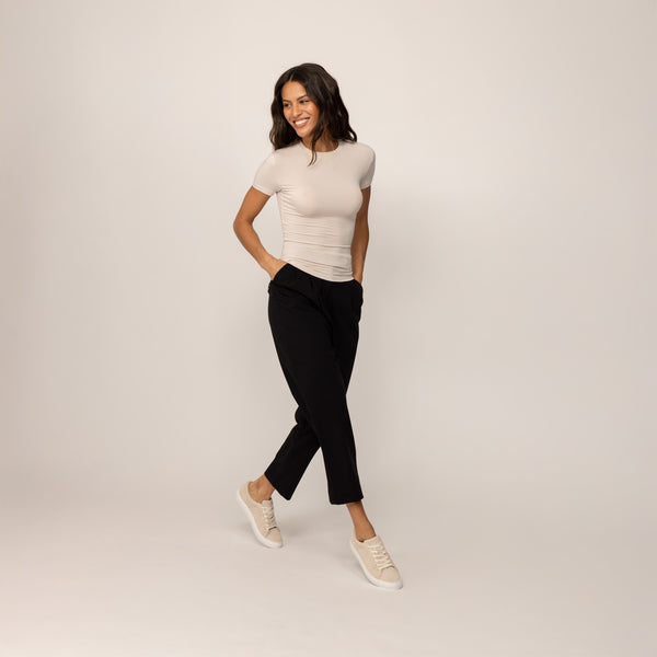 Woman wearing a Marame Fitted T-Shirt in Cosy Cream, front view.