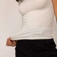 Woman wearing a Marame Fitted T-Shirt in White, closeup.