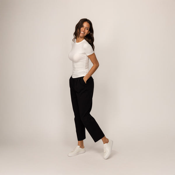 Woman wearing a Marame Fitted T-Shirt in White, front view.