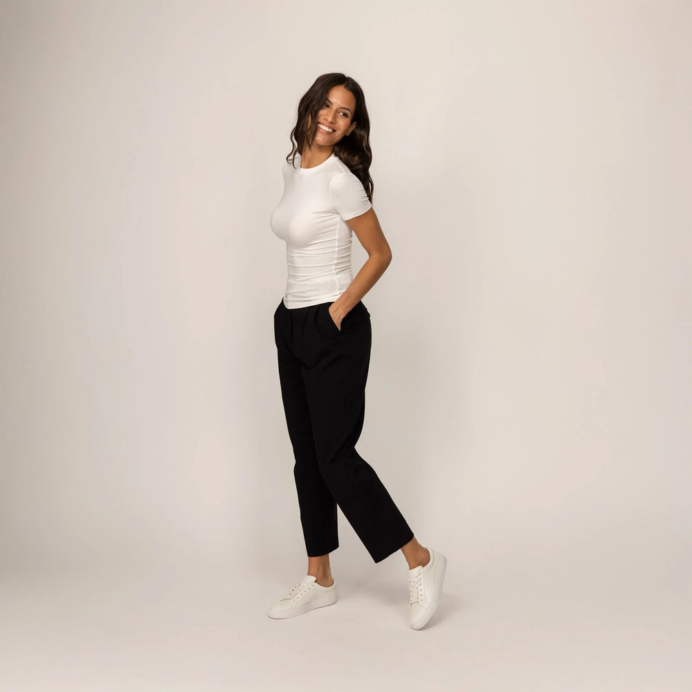 Woman wearing a Marame Fitted T-Shirt in White, front view.