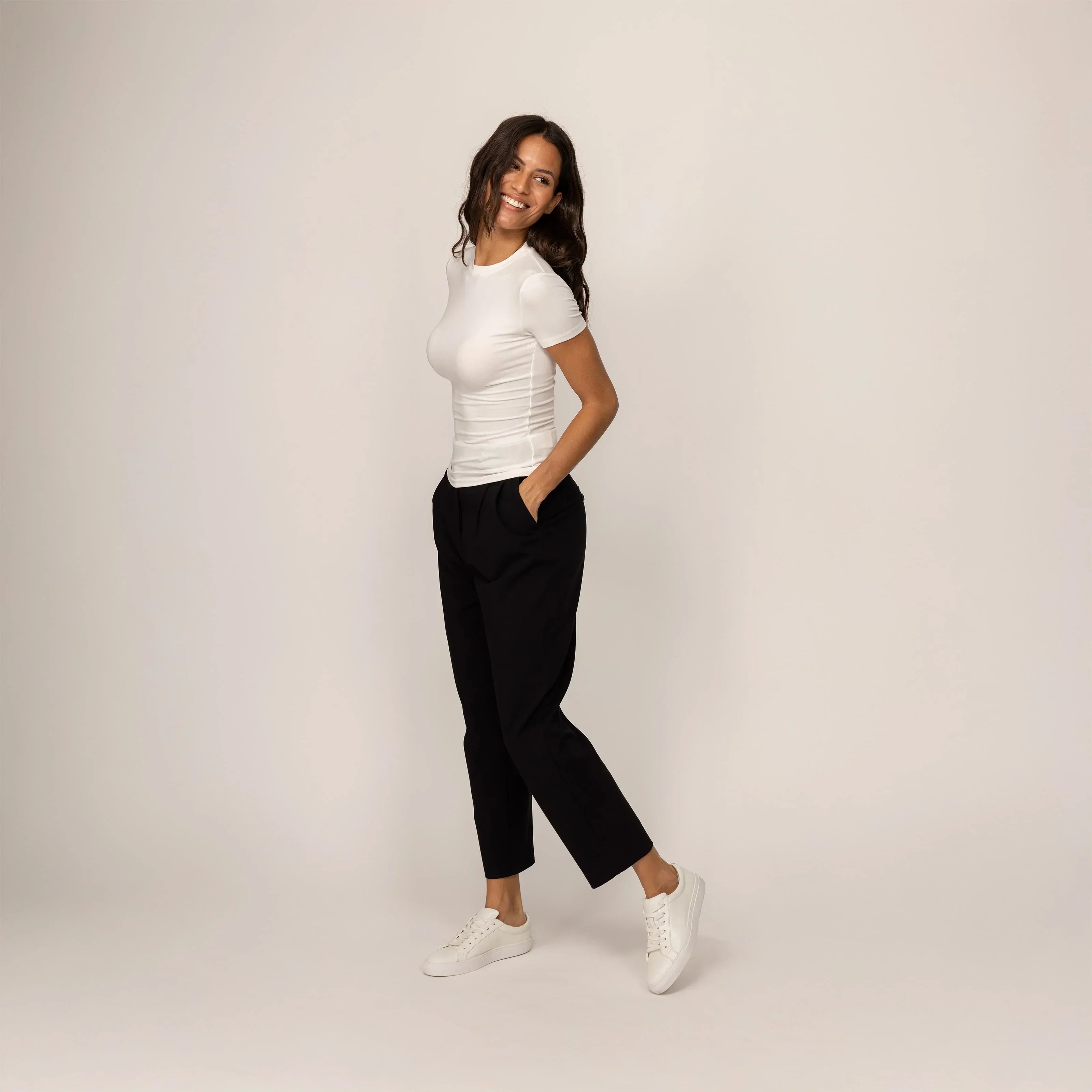 Woman wearing a Marame Fitted T-Shirt in White, front view.|white