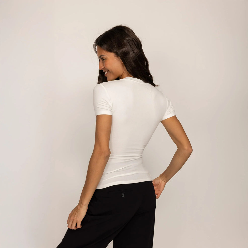 Woman wearing a Fitted T-Shirt in White, rear view.