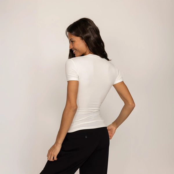 Woman wearing a Fitted T-Shirt in White, rear view.|white