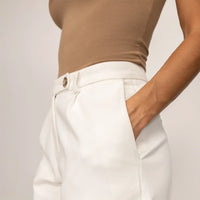 Woman wearing High-Waisted Smart Trousers in White Cream, detail. |white cream