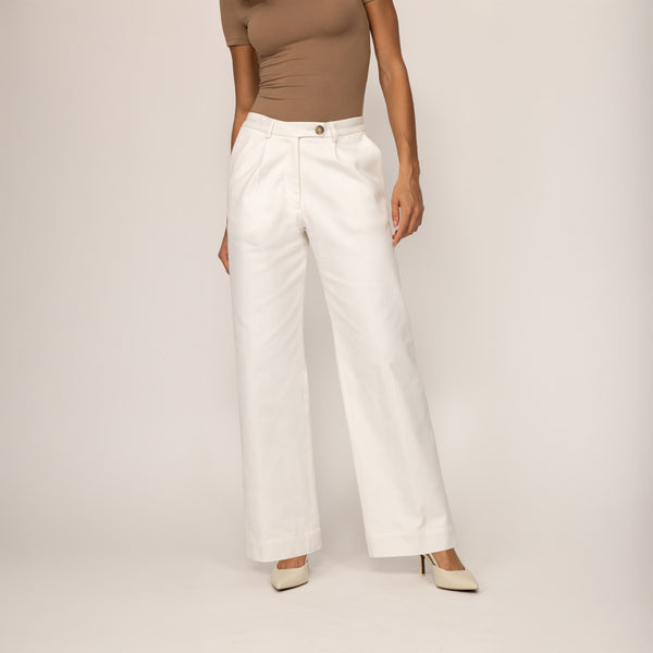 Woman wearing Marame High-Waisted Smart Trousers in White Cream, front view.