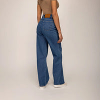 Woman wearing High-Waisted Wide Leg Jeans in Deep Wash Navy Denim, rear view. |deep navy wash denim