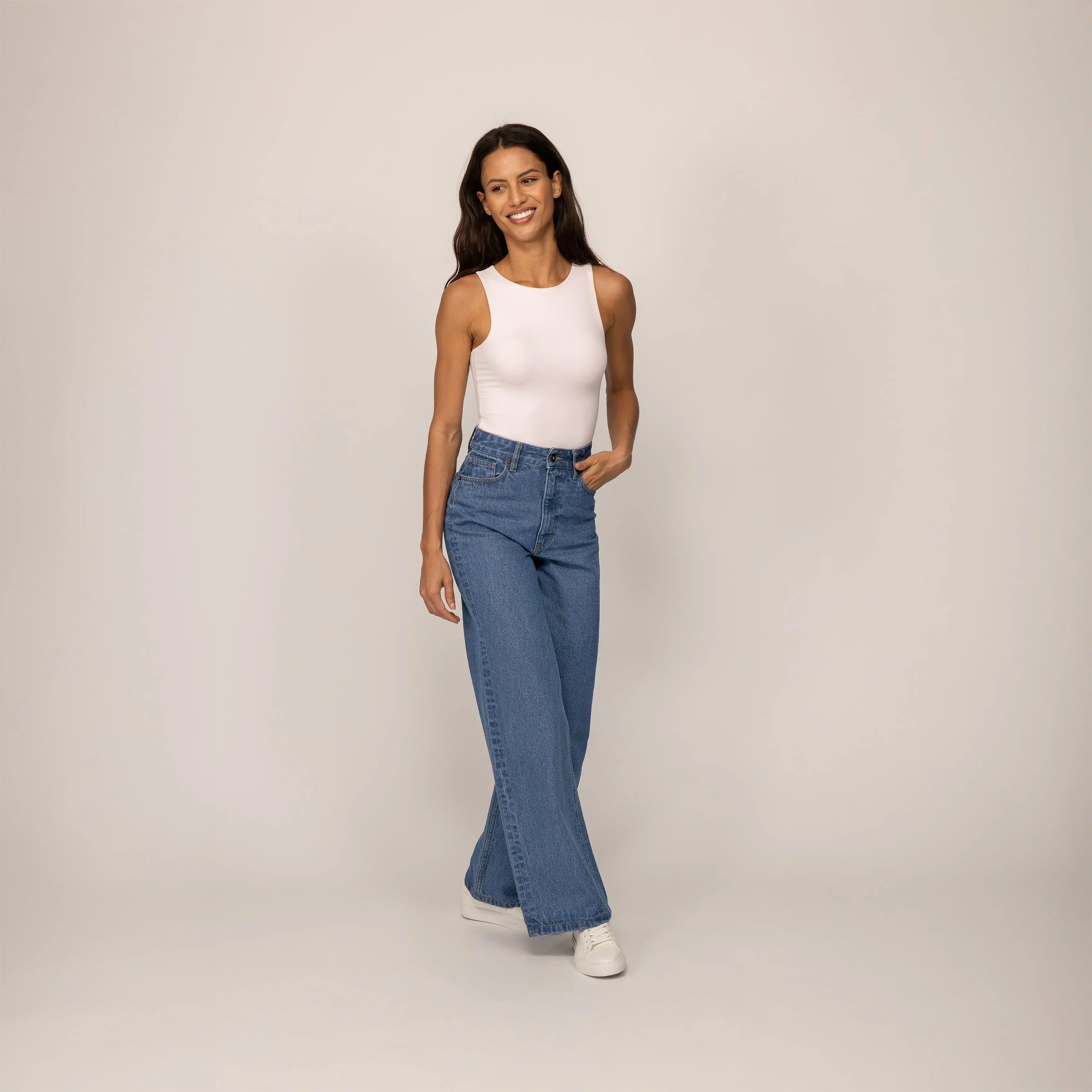 Woman wearing Marame High-Waisted Wide Leg Jeans in Light Wash Denim, front view. |blue wash denim