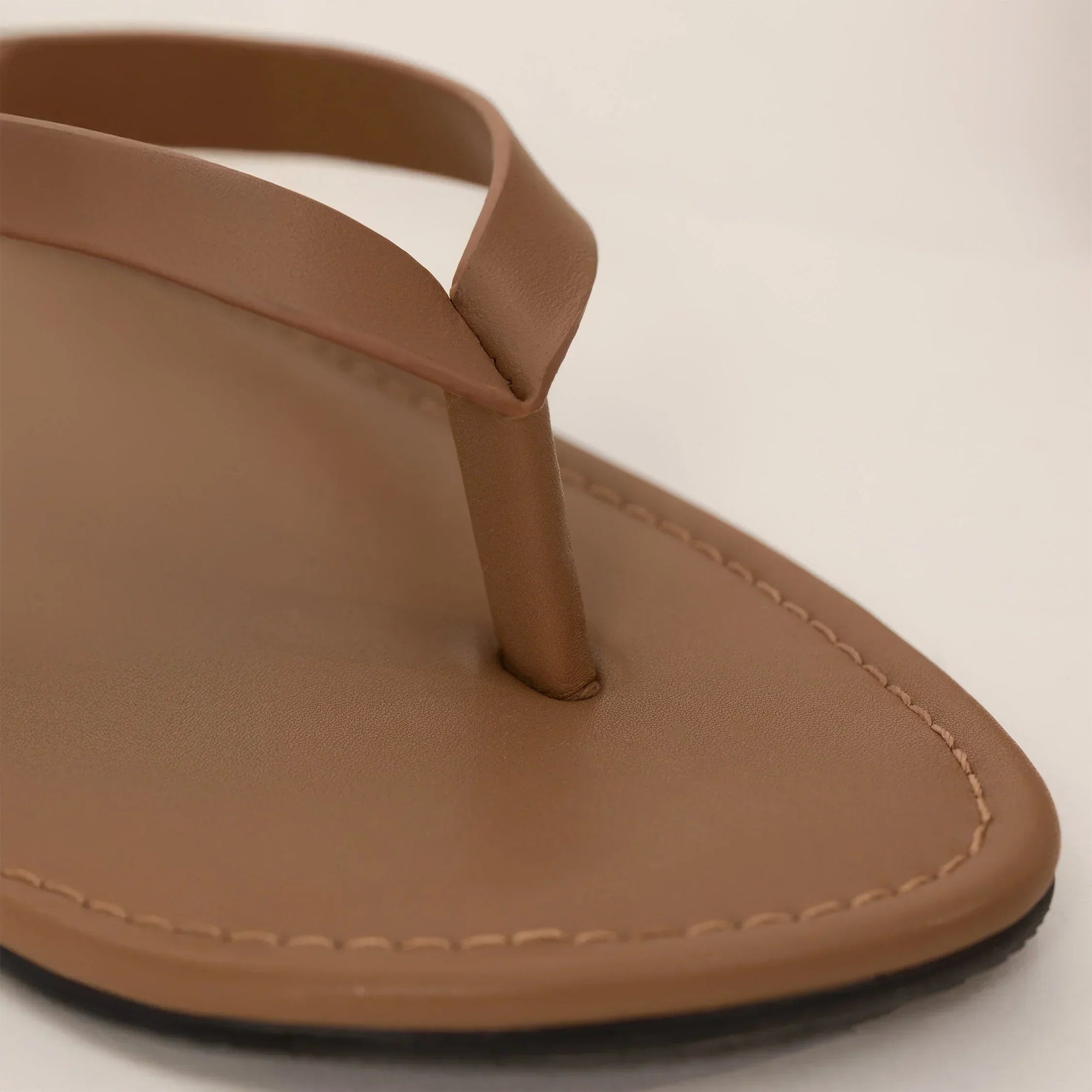 Marame Leather Flip Flops in Brown, closeup. |brown