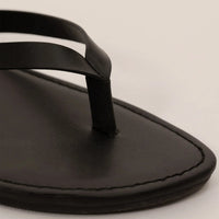 Marame Leather Flip Flops in Black, closeup. |black