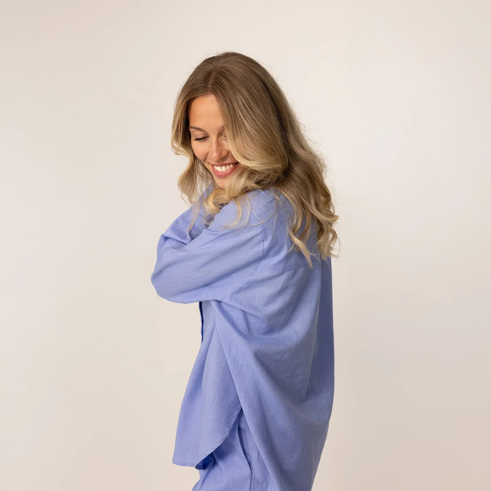 Side view of blue violet linen blend shirt, highlighting loose fit and silhouette