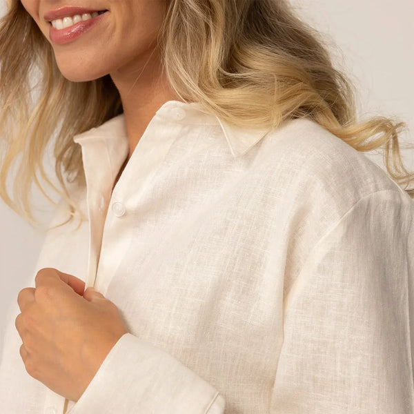 Close up of women’s off white linen blend shirt collar