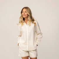 Woman wearing women’s linen blend shirt in off white, hands in pockets |off white