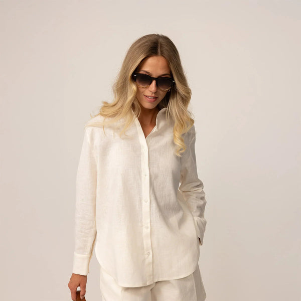 Woman posing in off white linen blend shirt and shorts |off white
