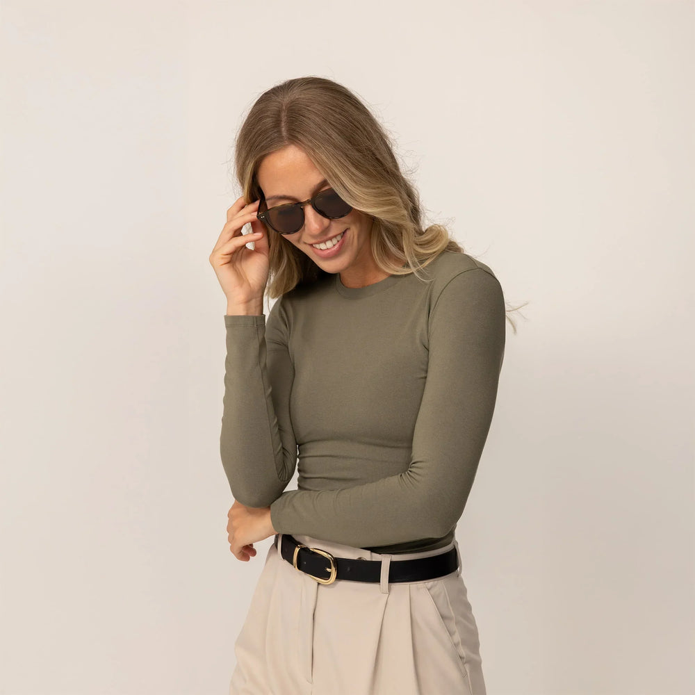 Woman wearing Marame Long Sleeve Fitted T-Shirt in Autumn Khaki, front view.