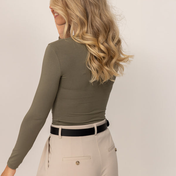 Woman wearing Marame Long Sleeve Fitted T-Shirt in Autumn Khaki, rear view.
